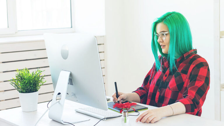 Teenage girl researching for the right digital art school